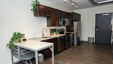 a kitchen and dining area in a 555 waverly unit